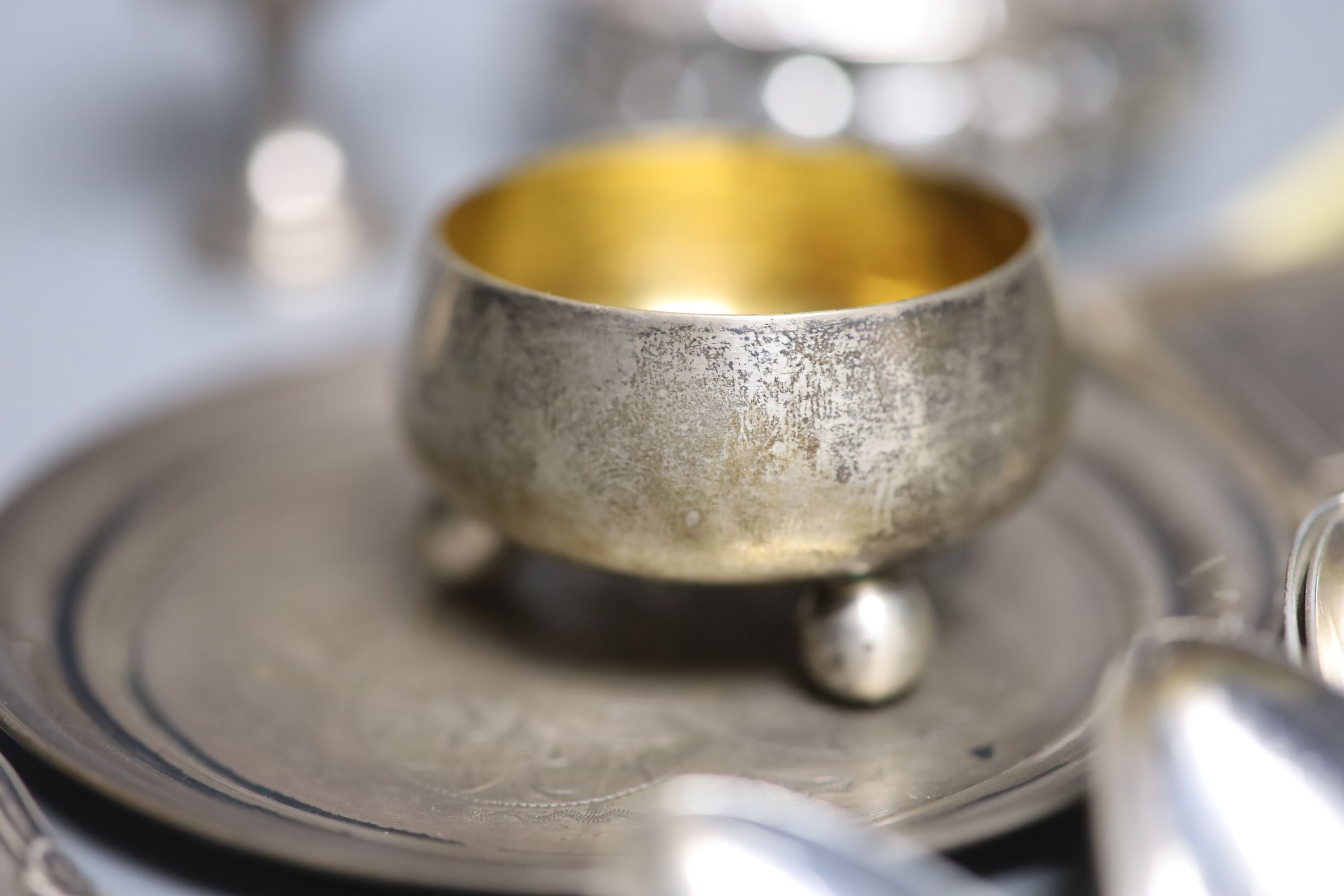 A George V silver sifter spoon and a quantity of assorted white metal items, including a Tiffany & Co sterling salt, a Swedish sifter ladle, sterling & enamel coffee spoons, etc.